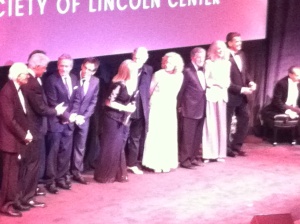Barbra in center on stage at event's close.