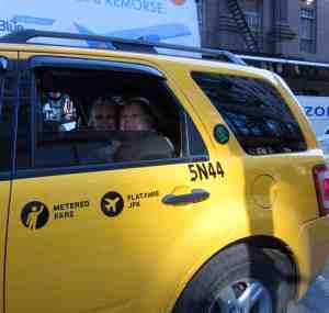 Jubilant Kathy and Sara in taxi heading toward the next leg in their life together.