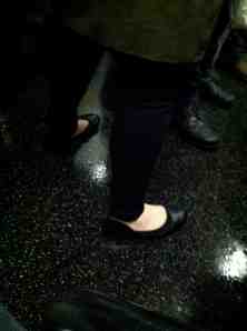 Subway rider who failed to read the memo that wearing ballet flats in 21 degree weather will not induce spring.