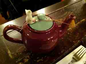 My tea pot with little cat stopper standing guard over high octane tea.