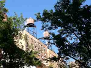 Upper West Side water towers looking good against a clear blue sky.