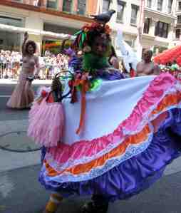 Yes, that is a live bird atop this green bearded bloke's head.