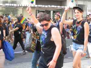 Lesbian and proud, or just stretching her arm.